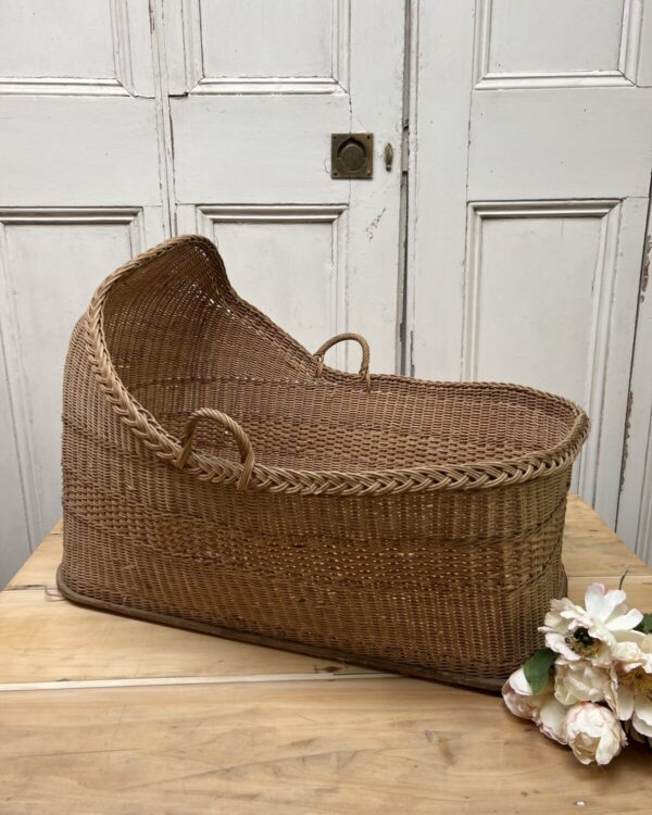 Antique wicker crib basket